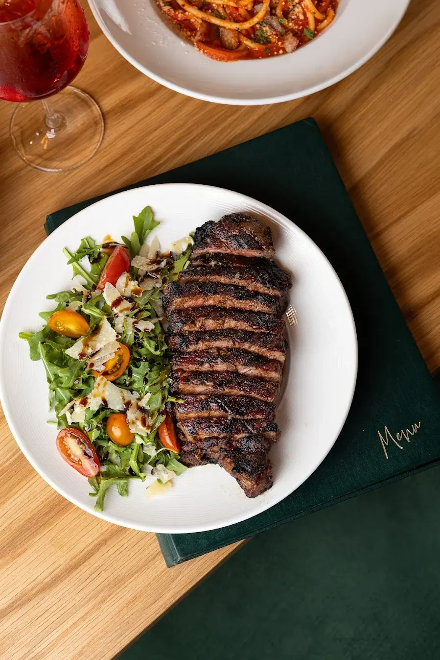 A large cut of beef, carved on the table