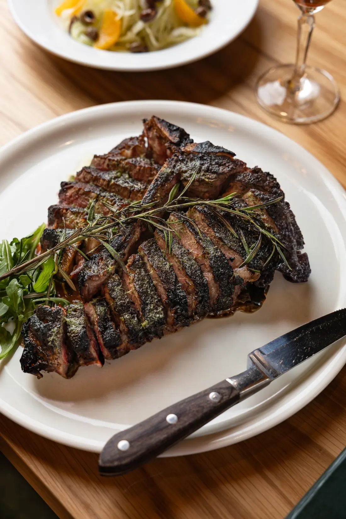 Bistecca, sliced and dressed with rosemary