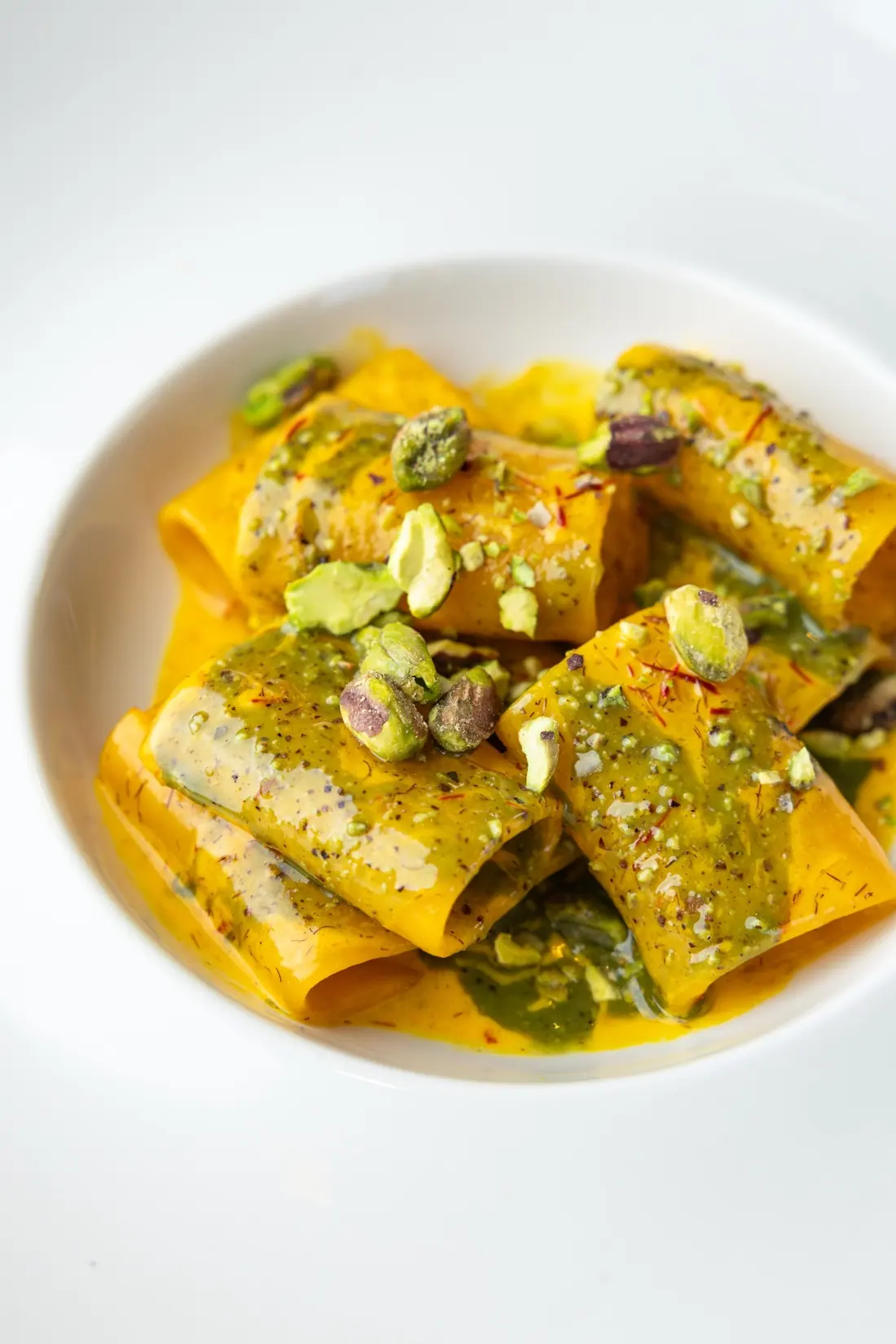 Paccheri in saffron cream with pistachio pesto